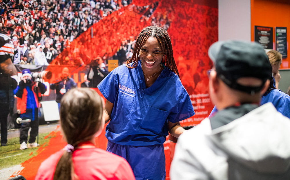 A UH provider talks to visitors to the Future Shades in Medicine Summit