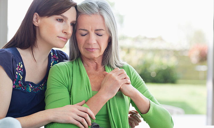 Woman comforting mother