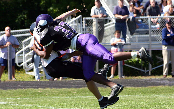 Football players tackle