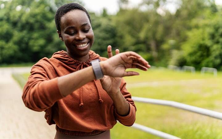 Woman checks wristwatch