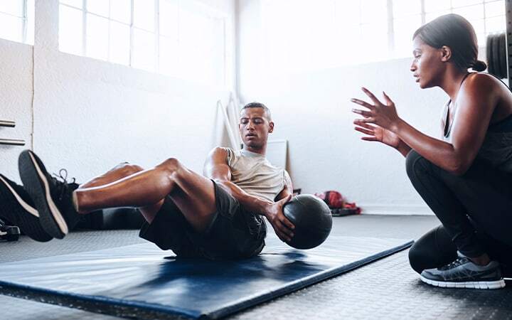 Man training with weighted ball