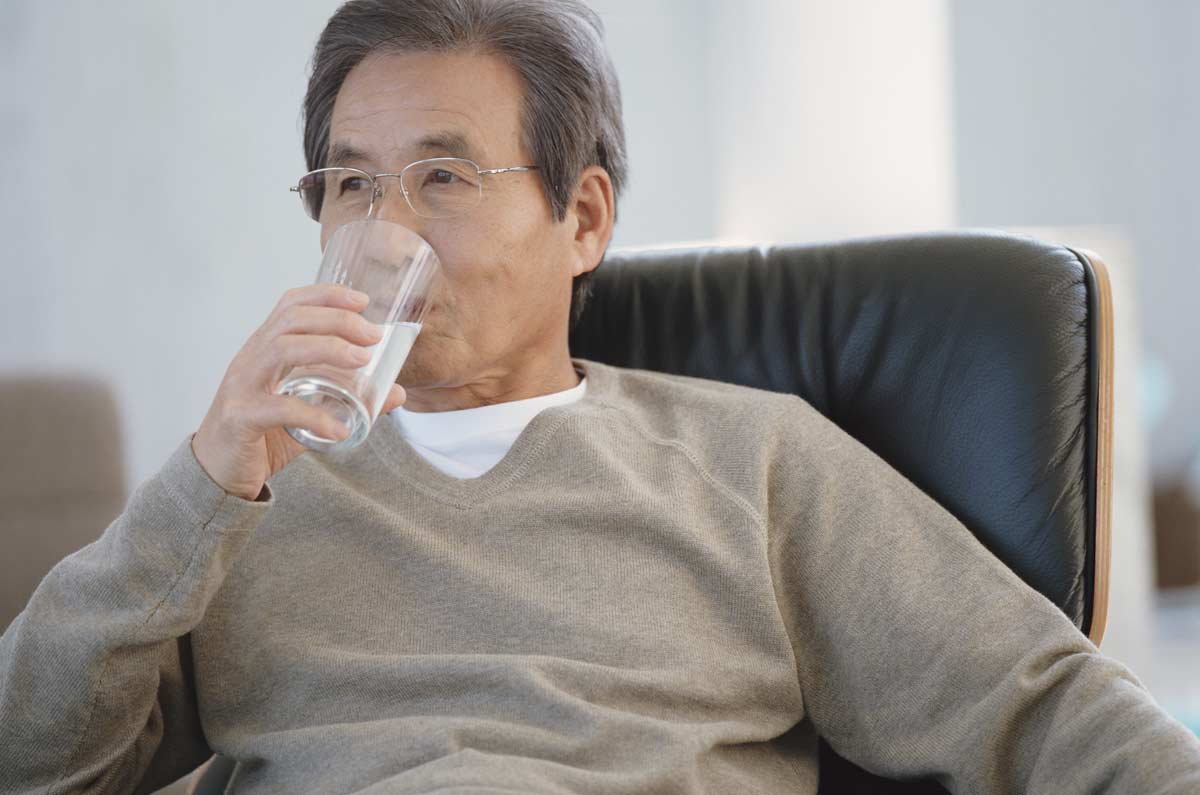 man drinking water