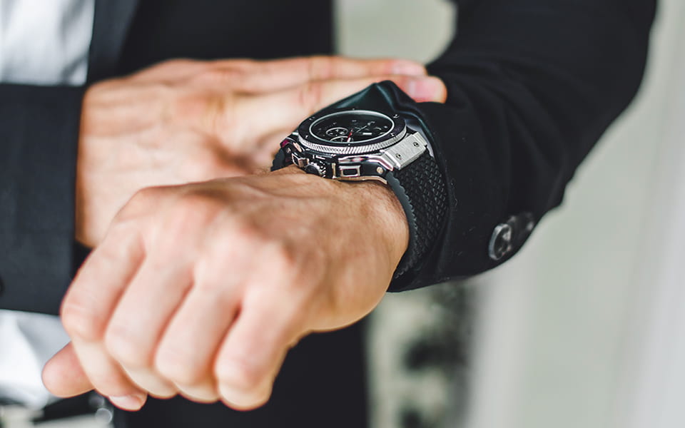 A businessman checking his watch
