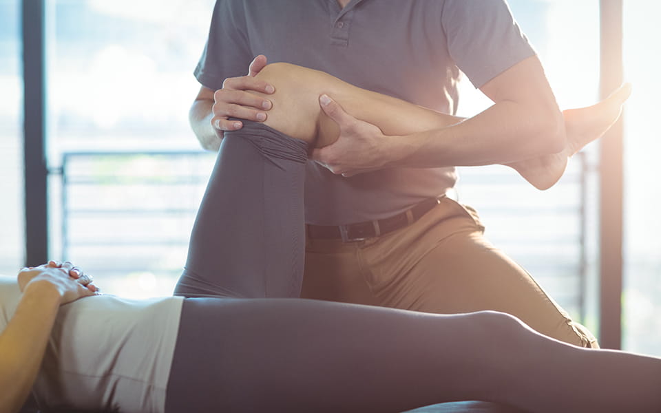 Woman being treated for knee injury