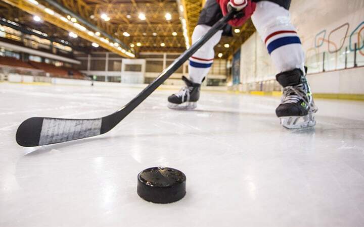 Hockey player dribbling a puck