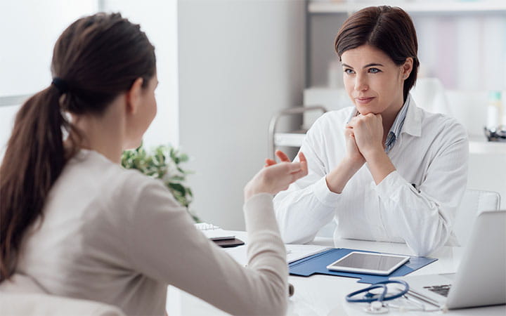 doctor talking with patient