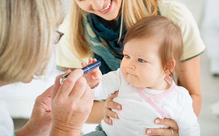 Checking baby's eyes