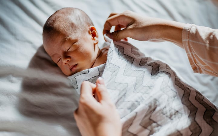 Swaddled newborn baby