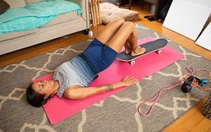 woman exercising on floor at home