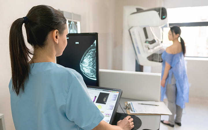 woman getting mammogram