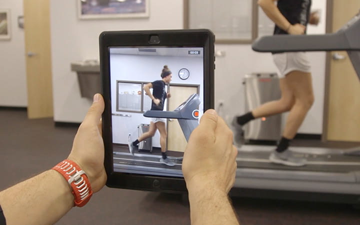 using an ipad to record man on treadmill