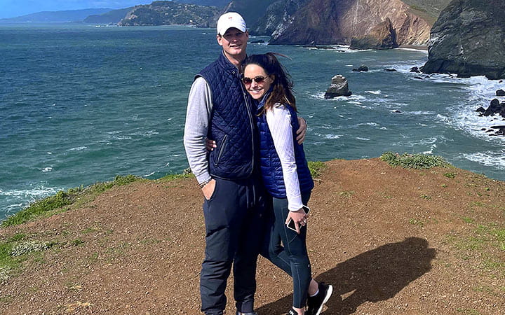 Tara Hyland and her husband on a beach in San Francisco.