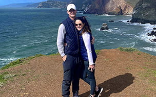 Tara Hyland and her husband on the beach