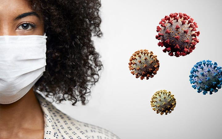 woman wearing face mask with coronavirus