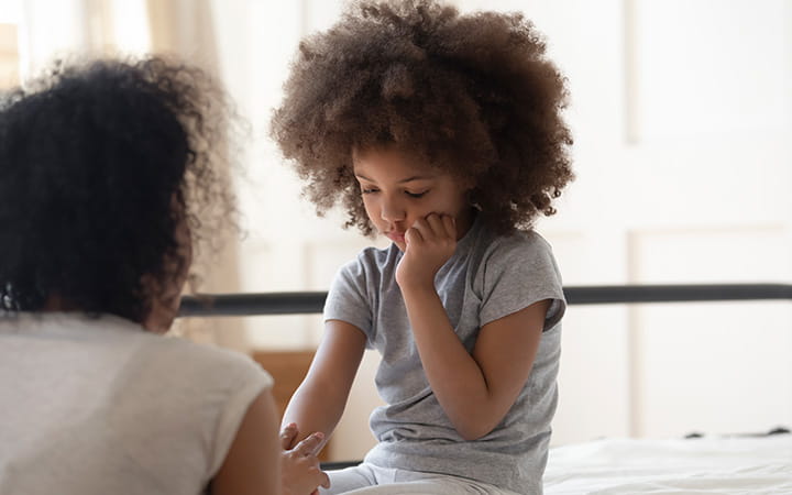 mom comforts young child