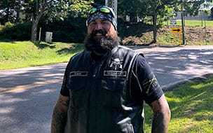 Sleep surgery patient Colin Vivolo stands along Route 555