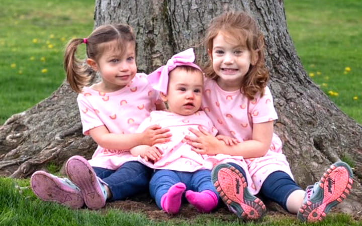 After undergoing thrombectomy, angioplasty and stenting procedures to clear a DVT clot and open her veins Sarah was able to have these three daughters.