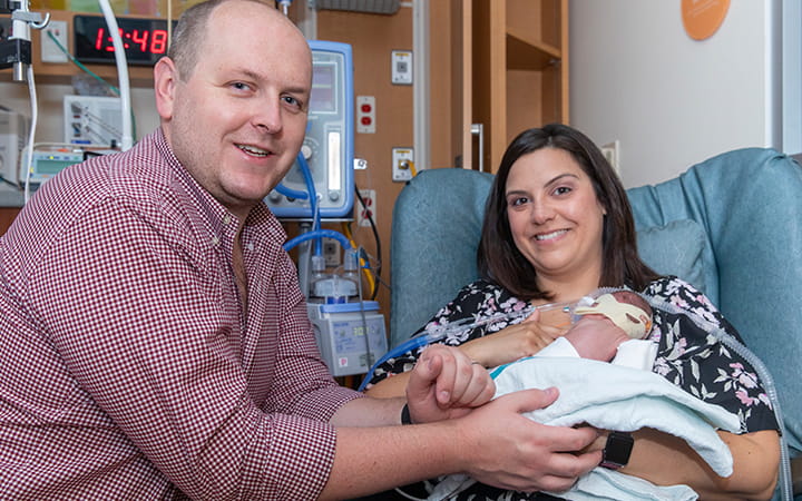 Ricky and Natassia Safranek with baby Lenny.
