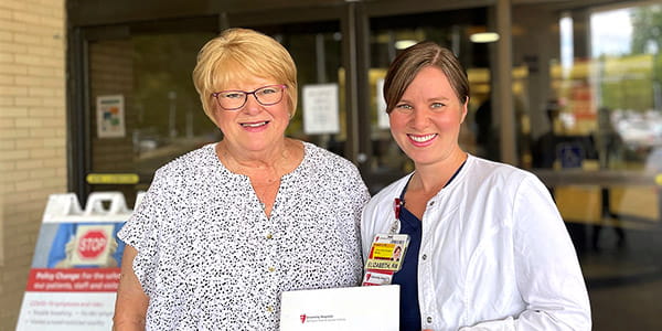 Christine Rand stands with Elizabeth Prahst, RN outside UH Parma Medical Center
