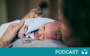 Woman holding her newborn after birth in hospital