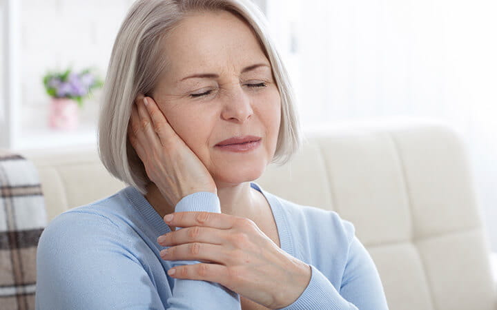 Closeup profile of a female having ear pain