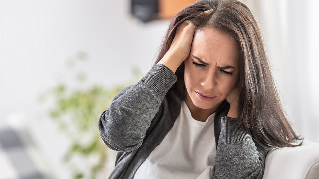 Wincing woman who hit her head