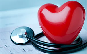 A heart shape on an electrocardiogram with a stethoscope