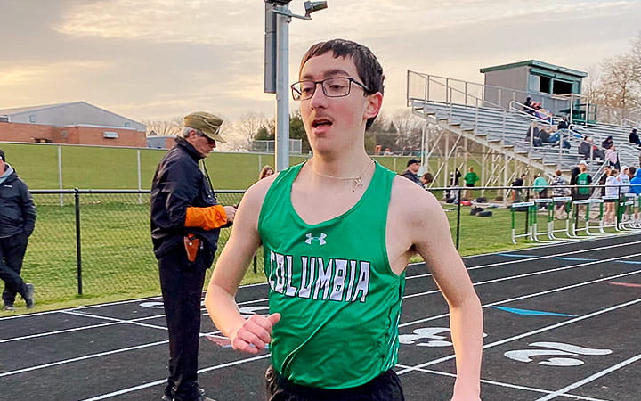 Joshua Miller running on the track