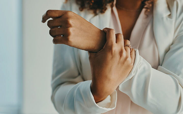woman holding her wrist