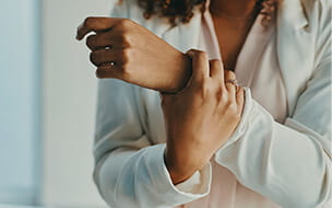 woman holding her wrist