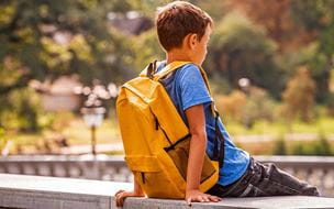 Child wearing backpack