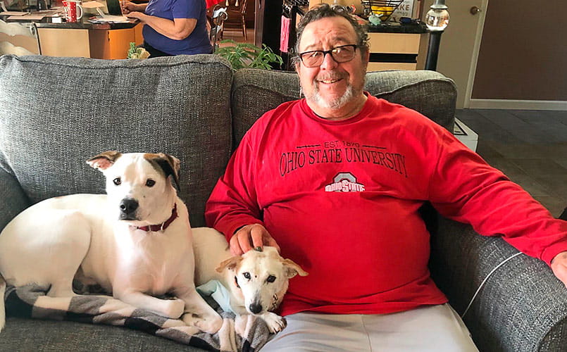 Rocco Greco relaxing at home with his dogs