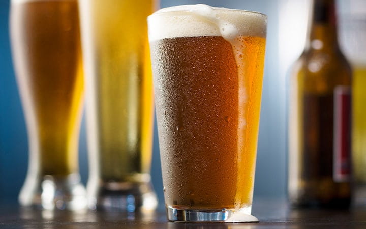 A selection of beer glasses and bottles