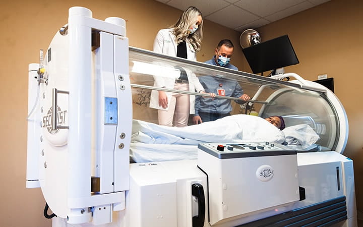 Patient in a hyperbaric oxygen chamber