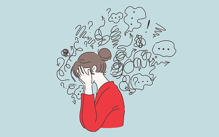 Confused woman holding head