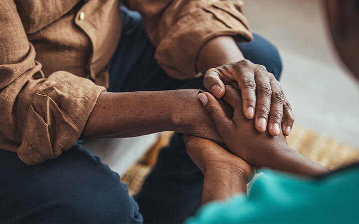 Close up of couple holding hands