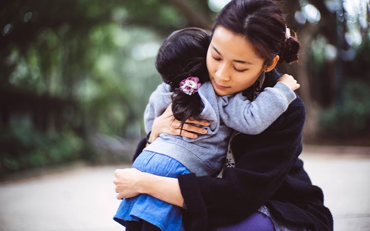 Mother hugging her toddler