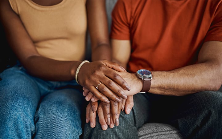 Couple holding hands