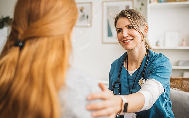 A nurse visiting a pregnant woman at home