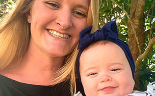 Whitney Keller and her baby, smiling