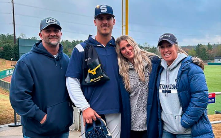 Ryan Rogers (left) poses with his family