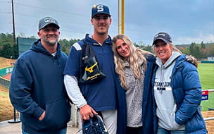 Ryan Rogers (left) poses with his family