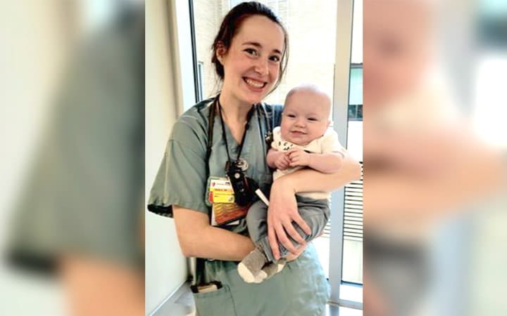 Reilly Krahe, RN, BSN holds Charlie Wells