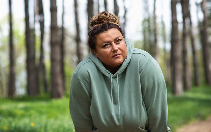 A woman is resting after weight loss training