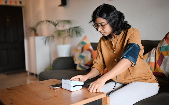 woman testing blood pressure