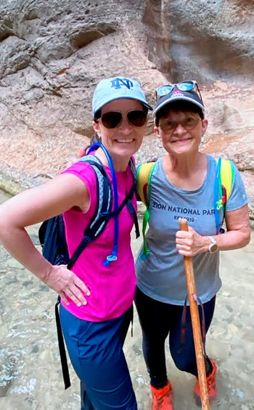 Rosie Miklavcic hiking with a friend