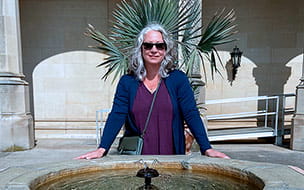 Aletah Whitman outdoors by a fountain