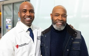 Dana Saunders Sr. poses with Ronald Charles, MD