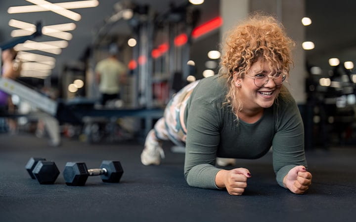 Young woman with weights