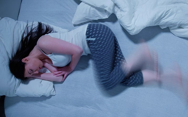Sleeping woman moving her legs